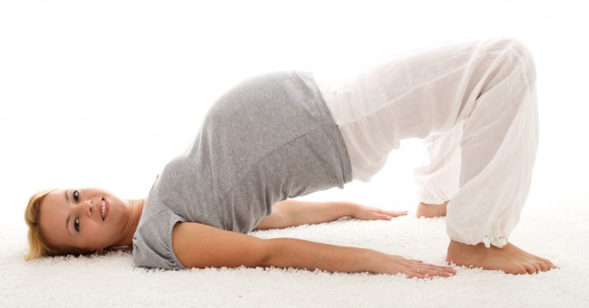 Beautiful_pregnant_woman_doing_exercises_on_the_floor.jpg