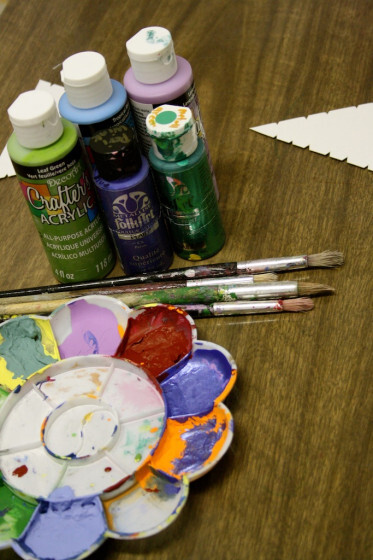 a variety of acrylic paints for wool wrapped tree ornaments